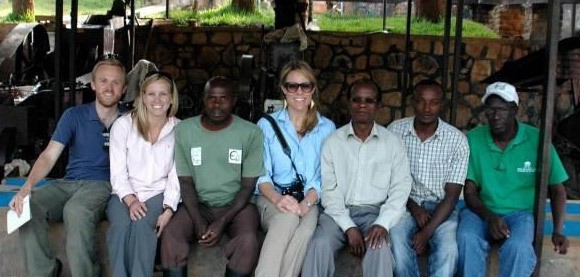 The Global Knowledge Initiative’s Andrew Gerard, Amanda Rose and Sara Farley with Dr. Daniel Rukazambuga and his team at one of the coffee washing stations in rural Rwanda.